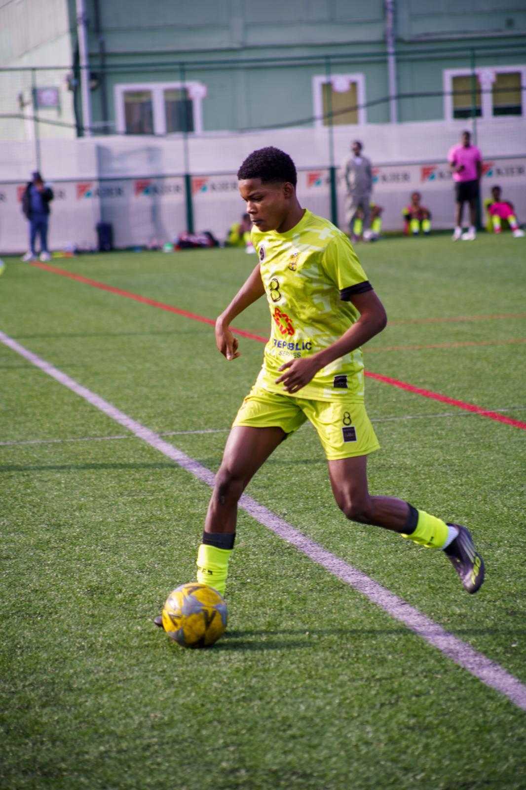Winger driving forward with the ball at pace