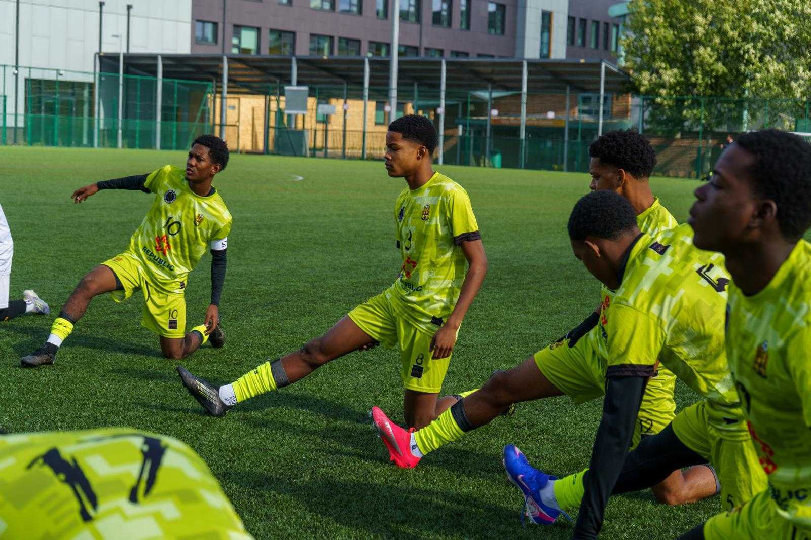 Squad stretching together at a pre-match warm-up