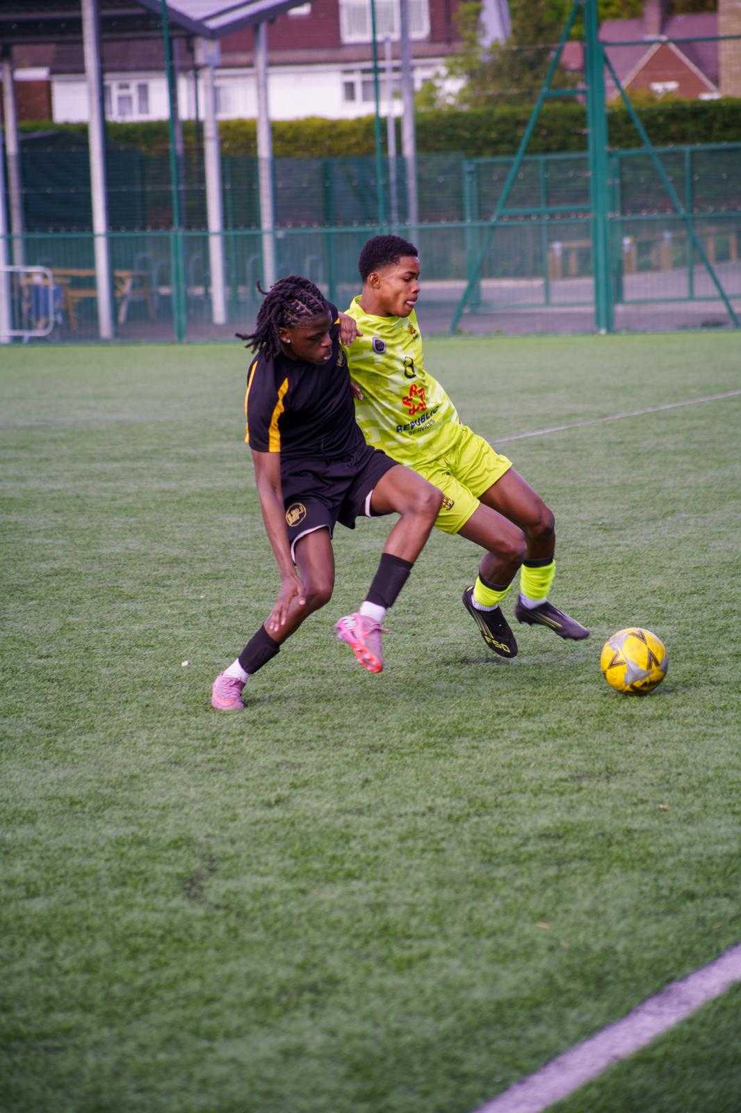 Players contesting a fifty-fifty tackle